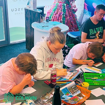 Children and adults having fun drawing and colouring pictures